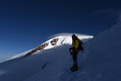 06C Guide Liza Pahl Waiting For Me On The Traverse With Mount Elbrus Main West Summit.jpg
